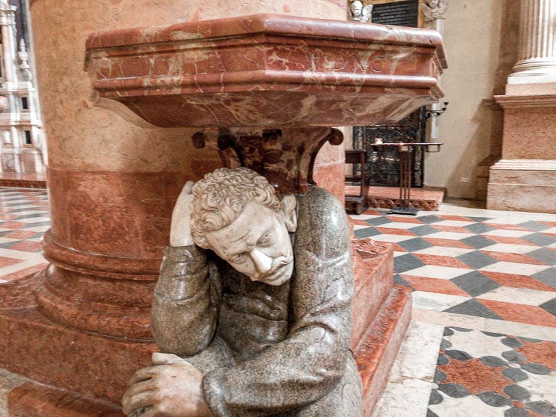 A seated man statue in the Duomo di Verona in Verona, Italy