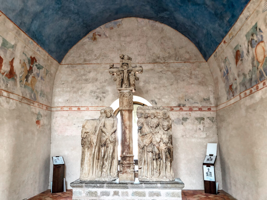 A chapel with statues and a blue ceilign in the Chataeu Comptal in Carcassonne. 