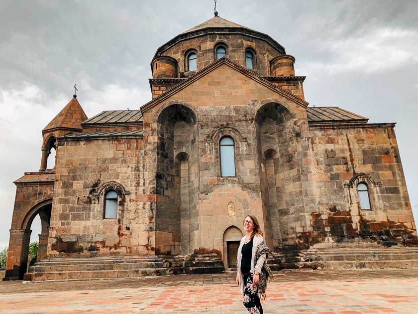 Cate in front of an Armenian monastery and church, one of the many destinations Sacred Wanderings has highlighted